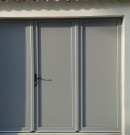 porte de garage battante pvc pleine - remplissage lisse - teinte gris argent