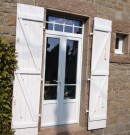 porte-fenêtre en pvc avec petits bois incorporés 